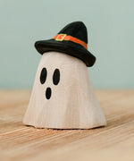 Bumbu handcrafted wooden ghost wizard decorative figure wearing a black hat.