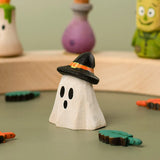 Bumbu handcrafted wooden ghost wizard decorative with other Halloween figures on a celebration ring in the background