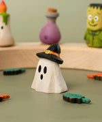Bumbu handcrafted wooden ghost wizard decorative with other Halloween figures on a celebration ring in the background