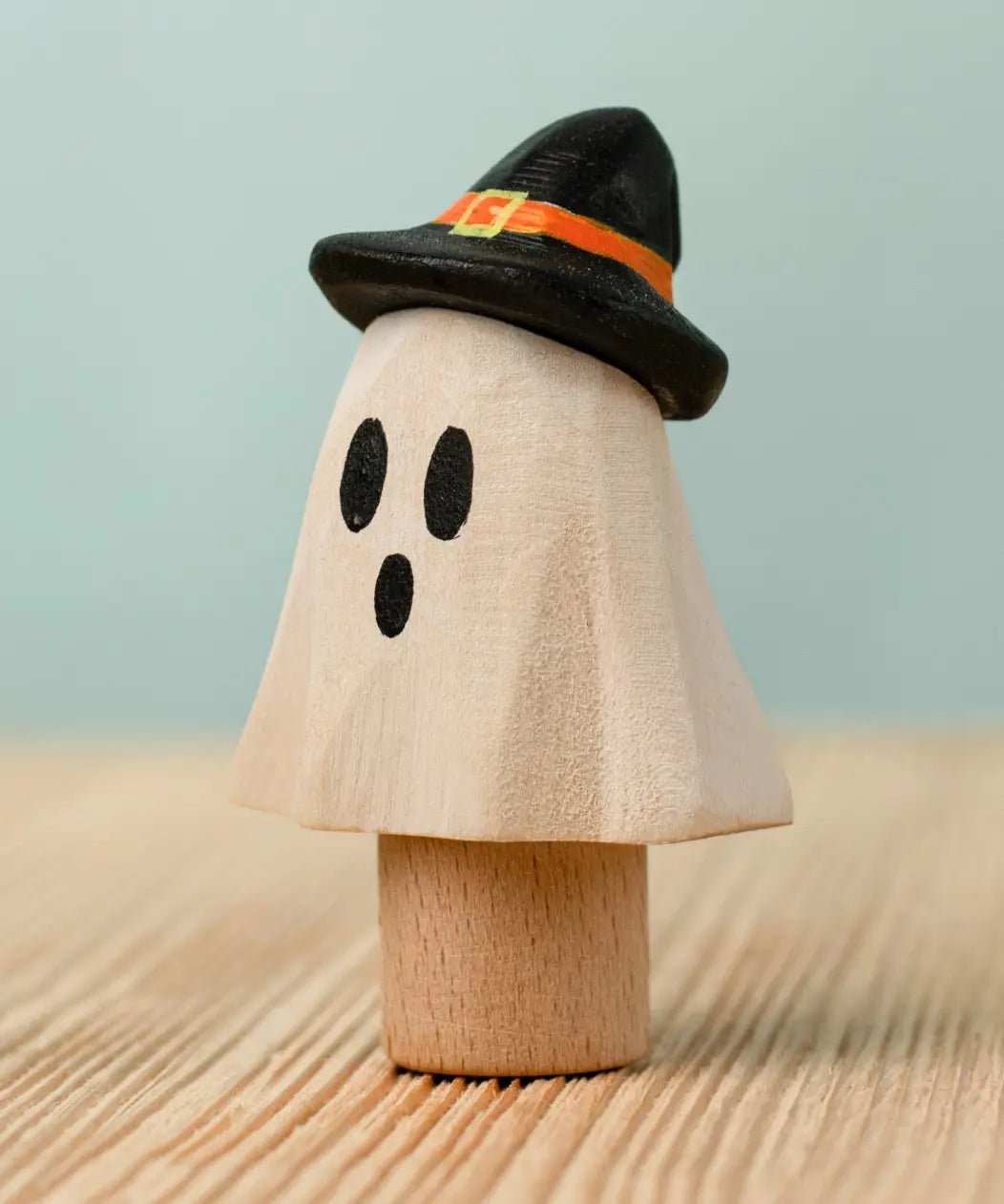 Bumbu handcrafted wooden ghost wizard decorative figure standing inserted on a wooden peg