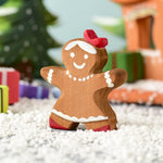 A Christmas scene including the Bumbu wooden gingerbread cookie girl
