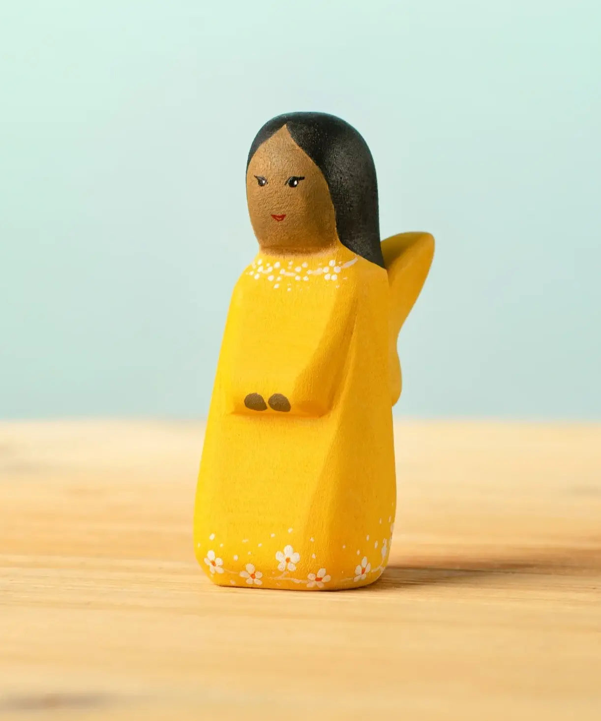 Bumbu handcrafted wooden golden fairy figure with painted black hair, flowers and facial features
