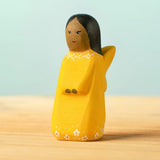 Bumbu handcrafted wooden golden fairy figure with painted black hair, flowers and facial features