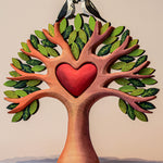 Bumbu Wooden Heart Tree. A beautifully crafted Wooden Tree with light brown branches with two Bumbu woodpecker figures sitting on top. 