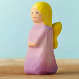 Bumbu handcrafted wooden lavender fairy figure with painted yellow hair, wings and facial features