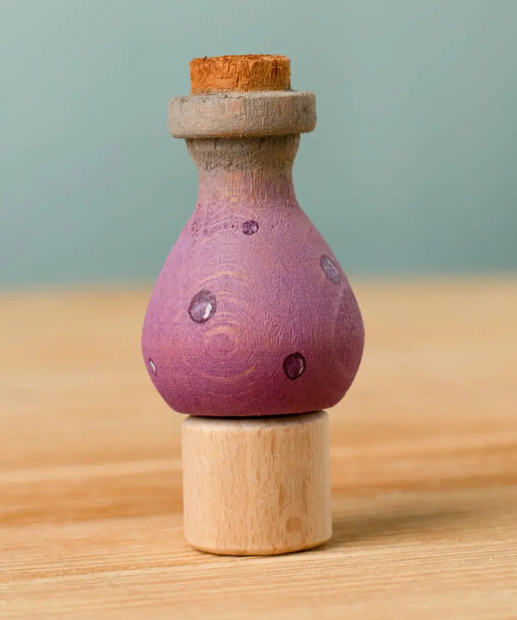 Bumbu handcrafted wooden magic potion decorative figure on a celebration ring peg base