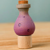 Bumbu handcrafted wooden magic potion decorative figure on a celebration ring peg base