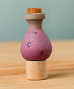 Bumbu handcrafted wooden magic potion decorative figure on a celebration ring peg base