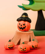 Bumbu handcrafted wooden magic pumpkin decorative figure displayed with smaller pumpkin and tree stump figures