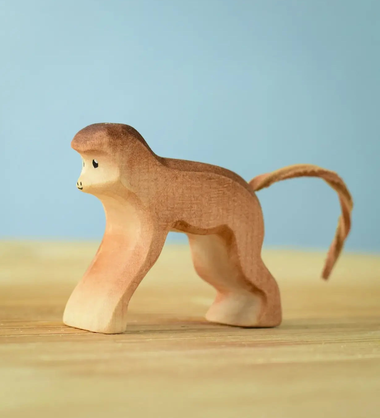 Bumbu toys handcrafted wooden brown standing monkey figure with a cord tail