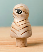 Bumbu handcrafted enchanted mummy decorative figure on a peg showing detailed bandages and painted eyes