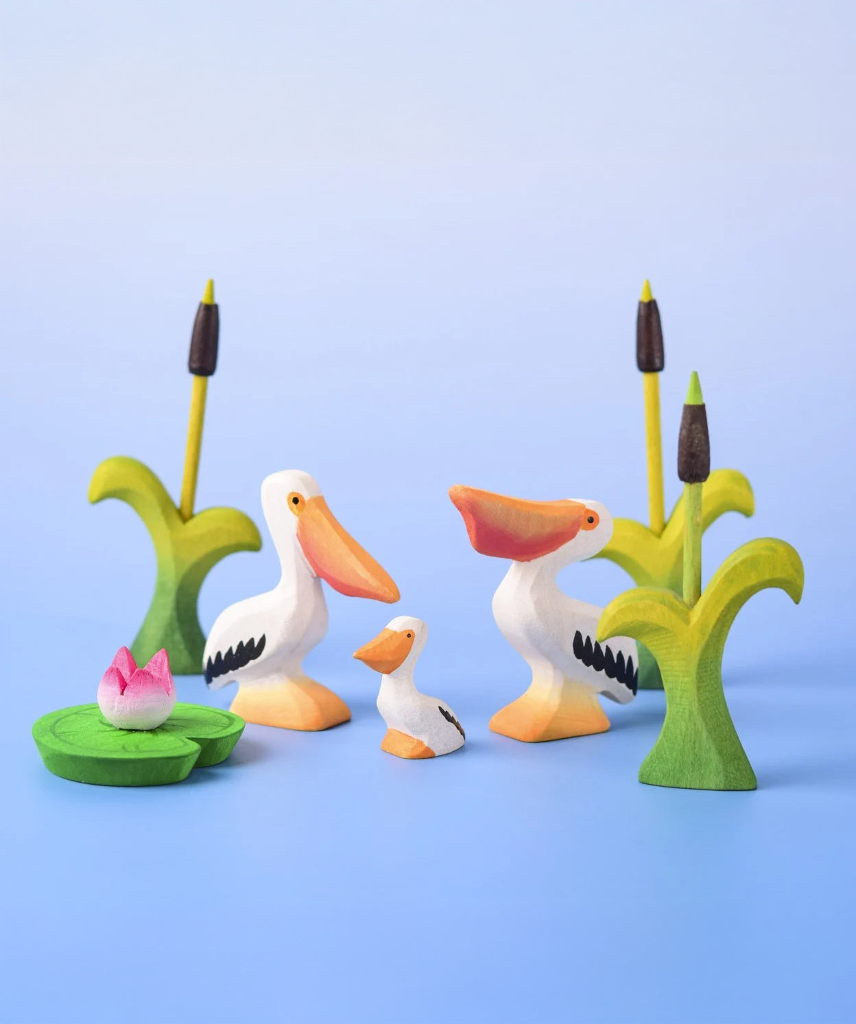 Bumbu Toys Eating Pelican, Pelican Chick and Pelican, all in a scene with Bumbu Cattails and Lilypads