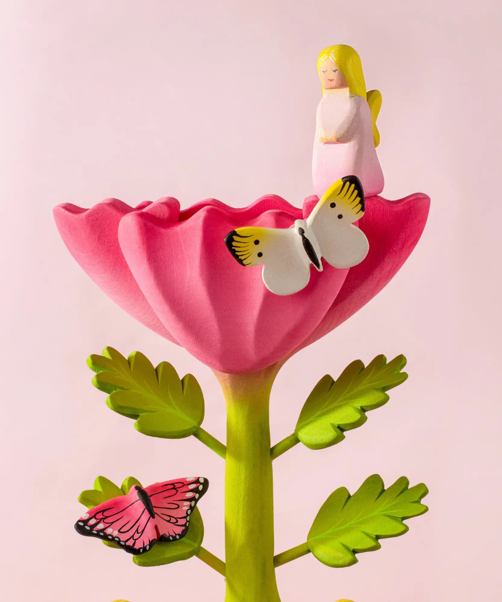 Bumbu wooden pink fairy figure standing on a pink flower building set with butterflies figures