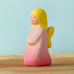 Bumbu handcrafted wooden pink fairy figure with painted yellow hair and facial features