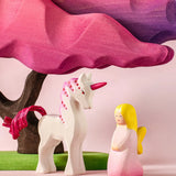 Bumbu wooden pink fairy figure next to a pink unicorn and blossom tree figure