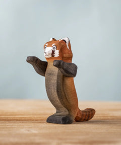 Bumbu wooden playful red panda figure standing on a wooden board