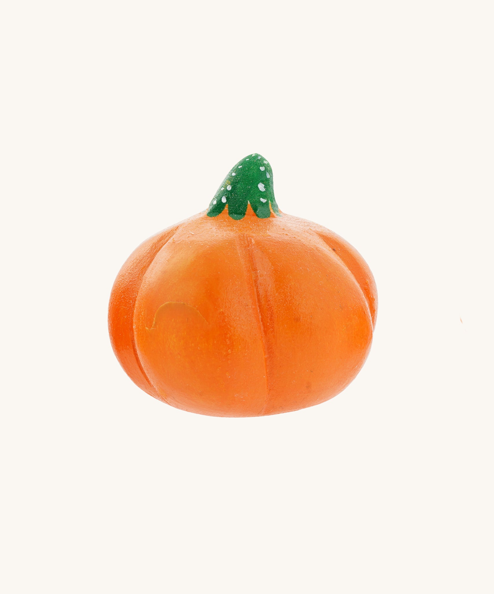 A medium Bumbu hand carved wooden pumpkin toy. These expertly hand crafted items are part of a large range of wooden toys available here at Babipur. 