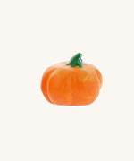 A small Bumbu hand carved wooden pumpkin toy. These expertly hand crafted items are part of a large range of wooden toys available here at Babipur. 