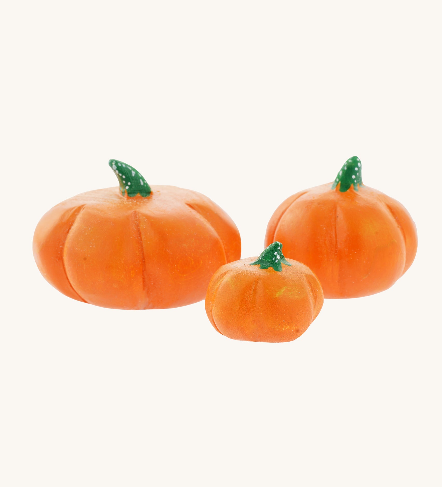 A set of three Bumbu, hand carved wooden pumpkin figures. A large Bumbu hand carved wooden pumpkin toy. These expertly hand crafted items are part of a large range of wooden toys available here at Babipur. 