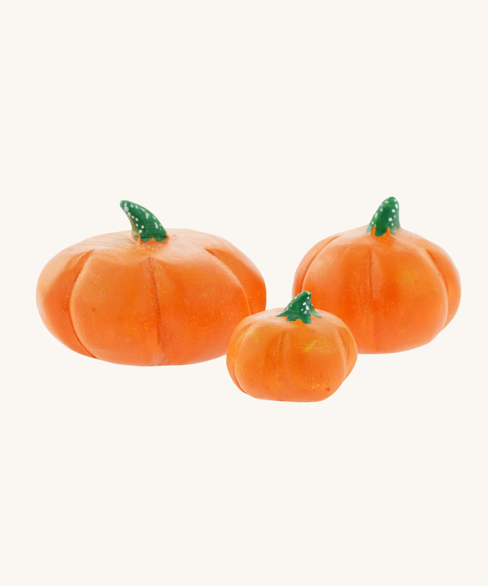 A set of three Bumbu, hand carved wooden pumpkin figures. A large Bumbu hand carved wooden pumpkin toy. These expertly hand crafted items are part of a large range of wooden toys available here at Babipur. 