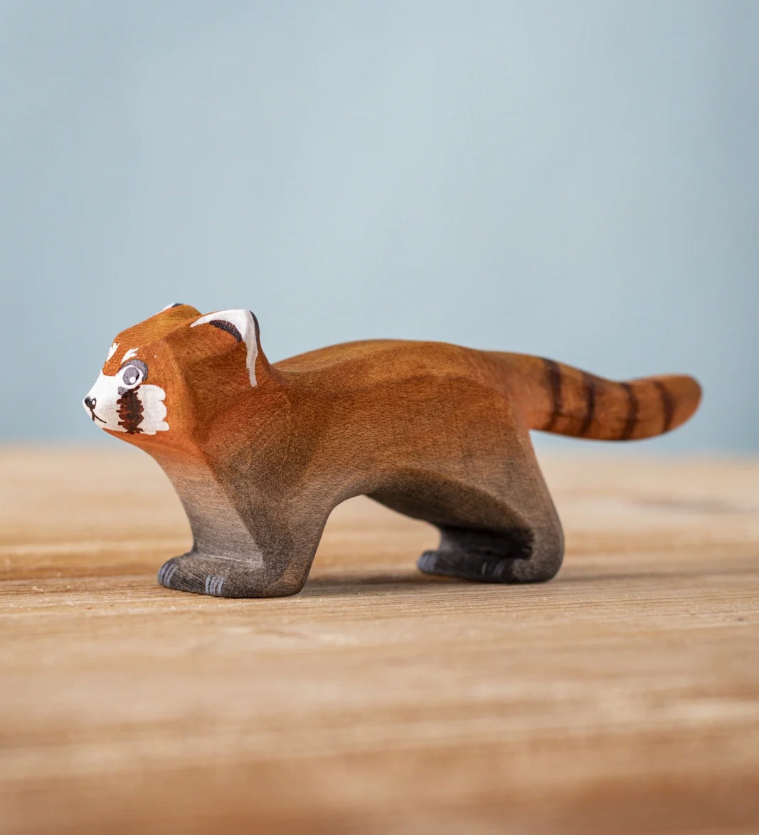 A Bumbu wooden red panda figure