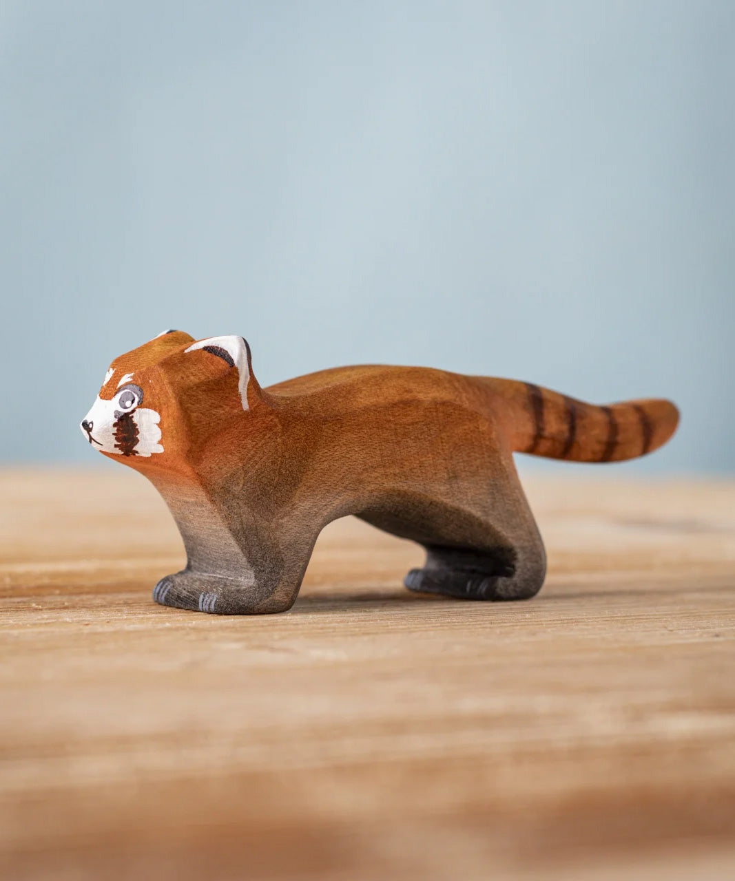 A Bumbu wooden red panda figure