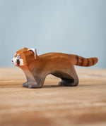 A Bumbu wooden red panda figure