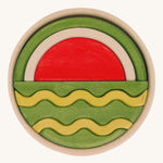 Bumbu Handmade Watermelon Round Wooden Puzzle on a plain background.