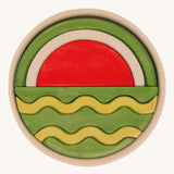 Bumbu Handmade Watermelon Round Wooden Puzzle on a plain background.
