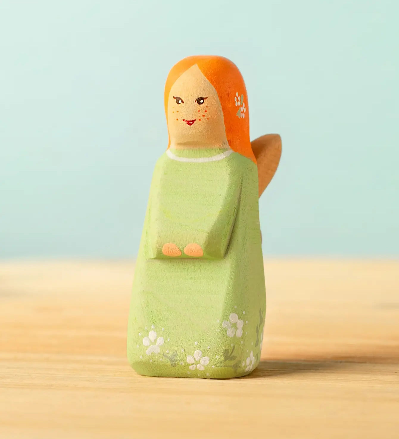 Bumbu handcrafted wooden sage fairy figure with painted ginger hair, flowers and facial features