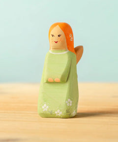 Bumbu handcrafted wooden sage fairy figure with painted ginger hair, flowers and facial features