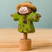 Bumbu handcrafted wooden scarecrow decorative figure with painted detail, wearing a brown hat and standing on a celebration ring peg base
