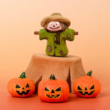 Bumbu handcrafted wooden scarecrow decorative figure in a spooky display including a tree stump and mini pumpkin figures