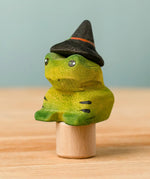 Bumbu handcrafted wooden magical frog decorative figure wearing a witch hat for Halloween decoration.