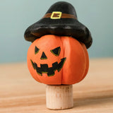 Bumbu handcrafted wooden magic pumpkin decorative figure wearing a black hat.