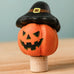 Bumbu handcrafted wooden magic pumpkin decorative figure wearing a black hat.