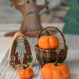 Three Bumbu pumpkins placed in a Kraul basket next to a Lanka Kade hermit figure. 