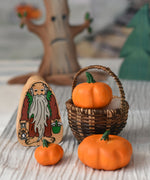 Three Bumbu pumpkins placed in a Kraul basket next to a Lanka Kade hermit figure. 