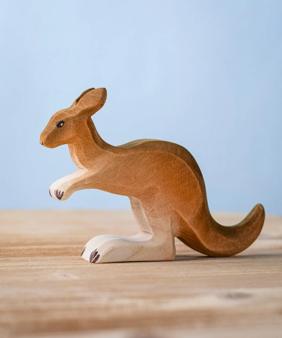 The Bumbu wooden toy kangaroo figure, hand-painted in brown shades.