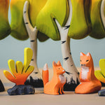 Bumbu animlas surrounded by Bumbu Wooden Birch Trees. The animals are of a bear with a squirrel sitting on its back
