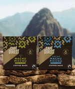 Cafedirect Machu Picchu Coffee Bags with fairtrade coffee for work and travel, with Peruvian mountains in the background.