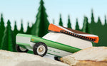 Close up of the Candylab childrens wooden big sur toy car on some large rocks