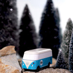 CandyLab blue VW T1 with '54' on the side - on a rock in a snowy forest scene.