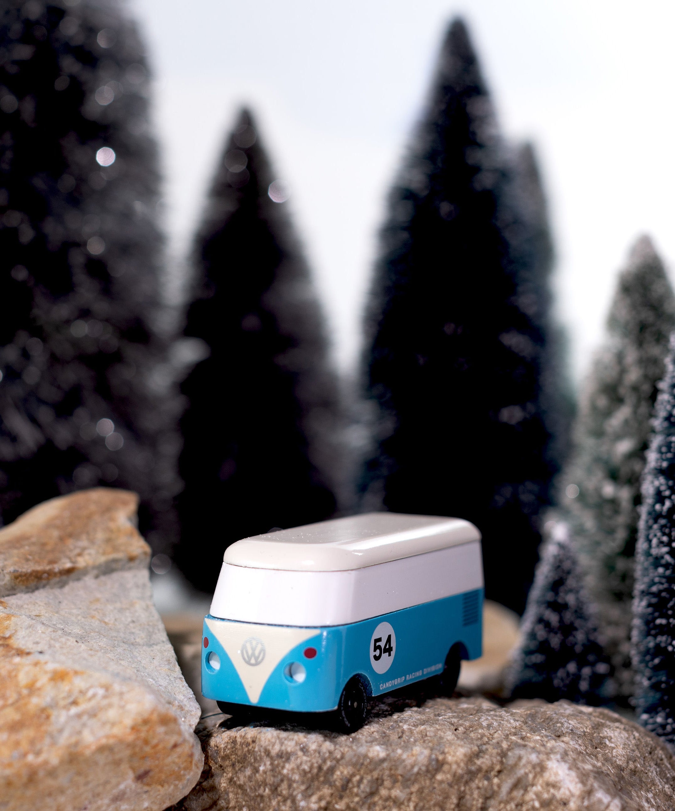CandyLab blue VW T1 with '54' on the side - on a rock in a snowy forest scene.