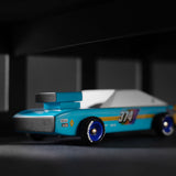 Close up of the Candylab children's seagull wooden race car toy in a black and grey background