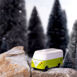 CandyLab green VW T1 Campervan - placed on a rock in a snowy forest.