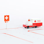 Candylab handmade wooden ambulance van toy on a red and white road layout