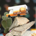 Candylab arizona campervan toy on top of a pile of large stones