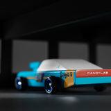 Close up of the back of the Candylab plastic-free racing car toy on a black and grey background