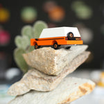 Candylab collectable childrens suv toy on a pile of large rocks